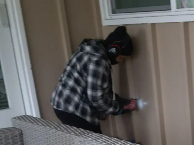 Professional electrician installing an exterior outlet in Medina